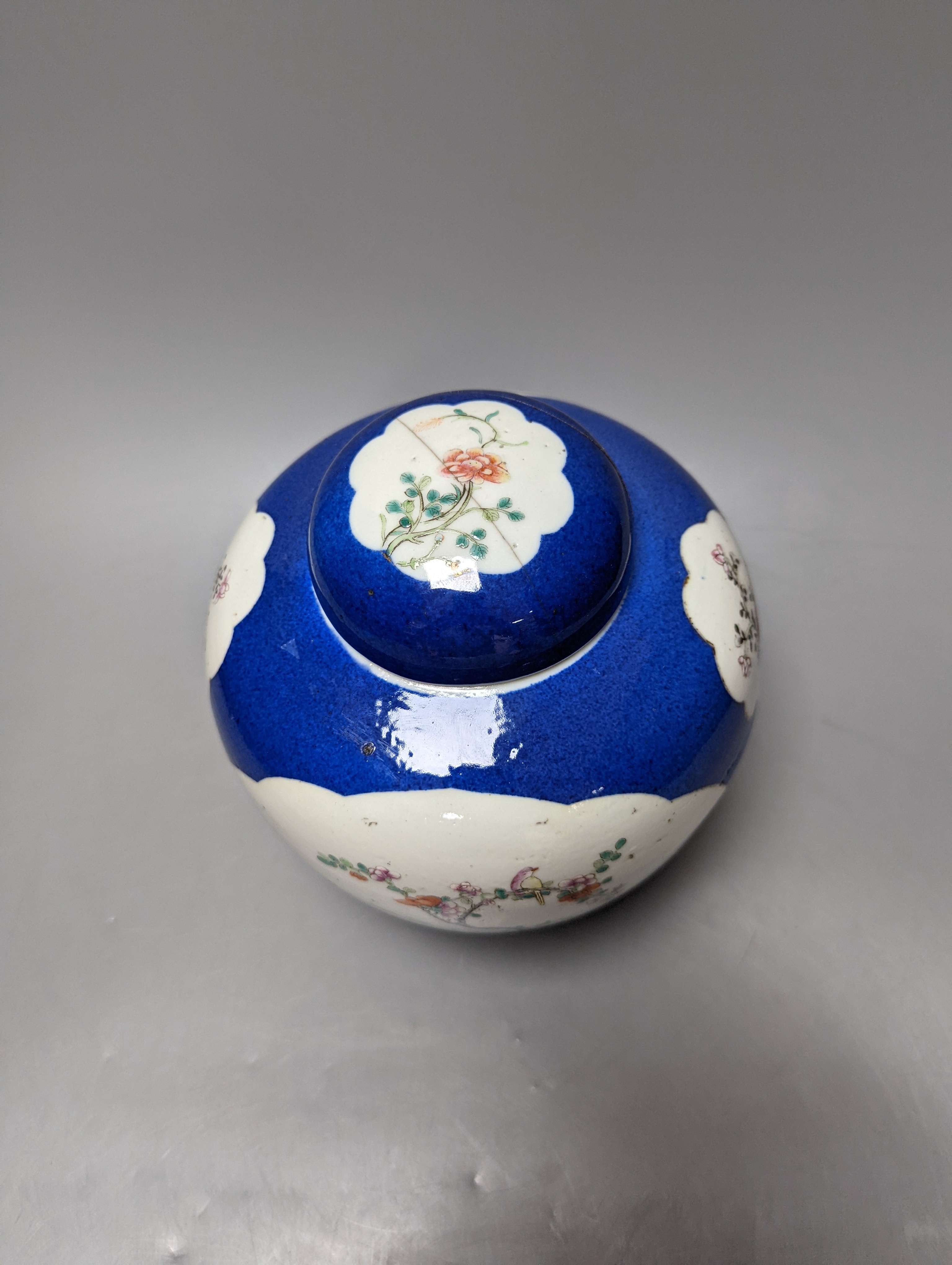 A Chinese blue ground jar and cover, 19th century, Qianlong mark to base, 20cm high